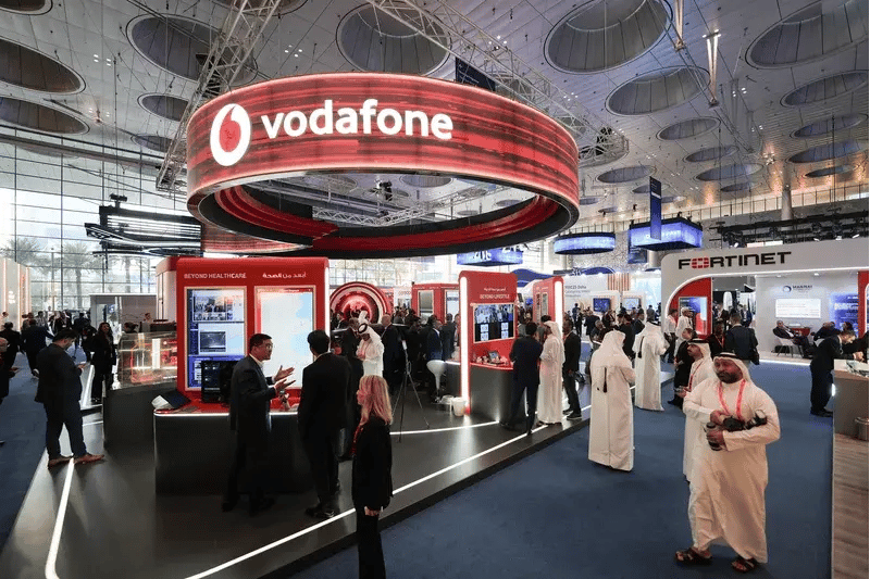 Wide view of the Vodafone stand at MWC Doha, showcasing technology demonstrations, industry solutions and networking opportunities for attendees across the exhibition floor.